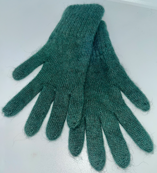 A pair of dark green knit touchscreen-compatible gloves laid flat on a light gray surface.