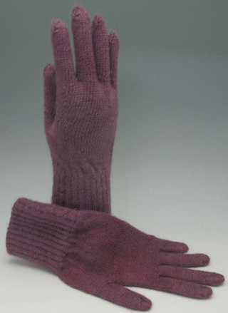 A pair of knit gloves in a muted plum or mauve color, with one glove standing upright and the other lying flat on a neutral gray studio background.